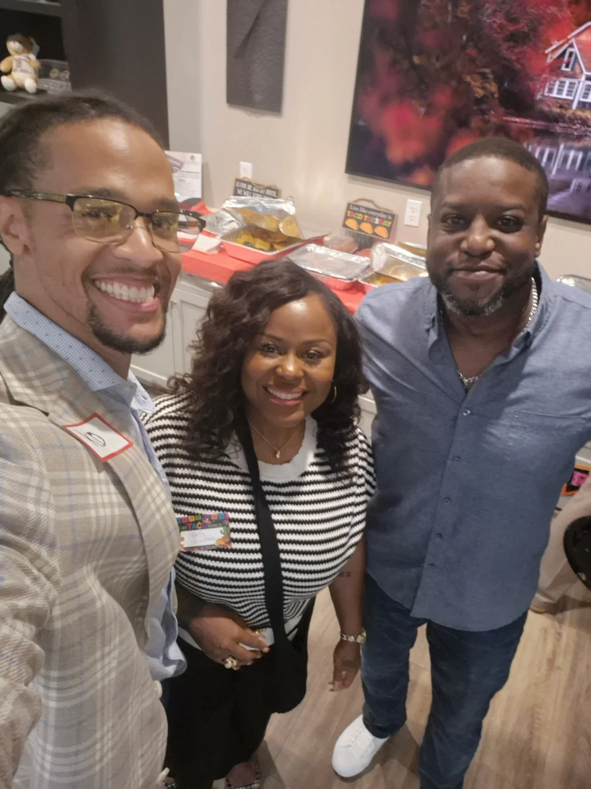 Three guests taking a selfie at the celebration