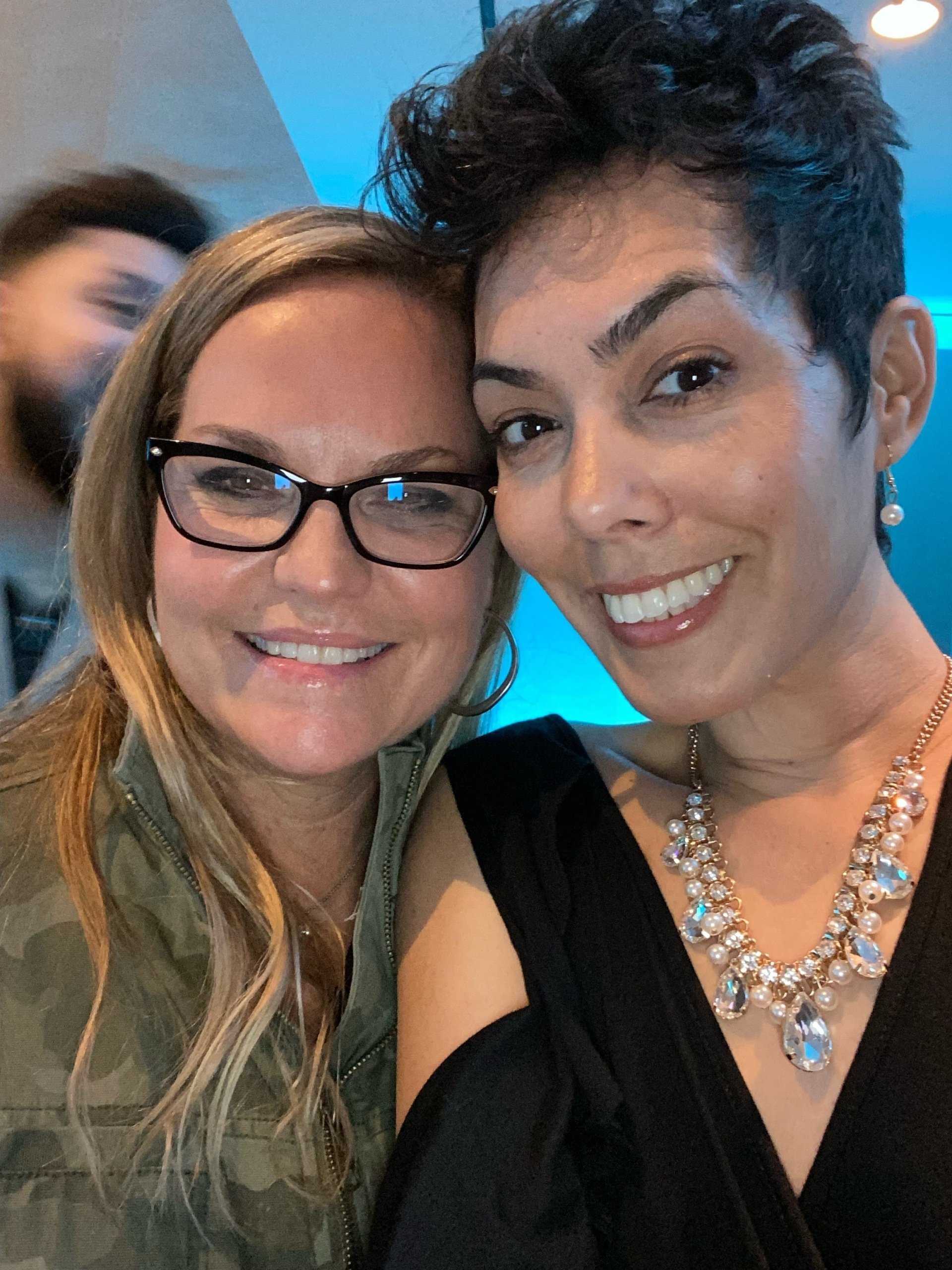 Dalila with a friend at a community celebration