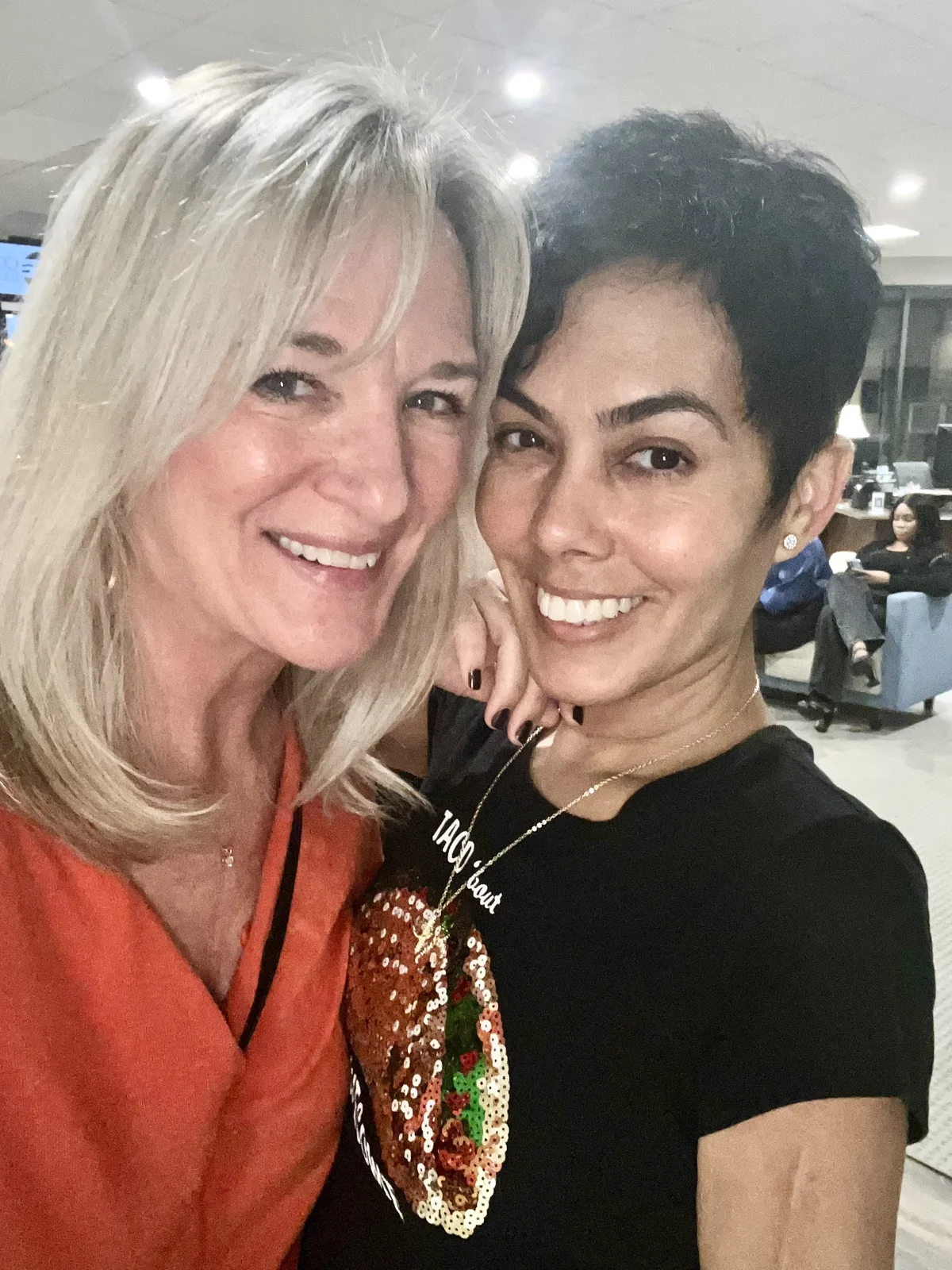 Two guests smiling for a selfie