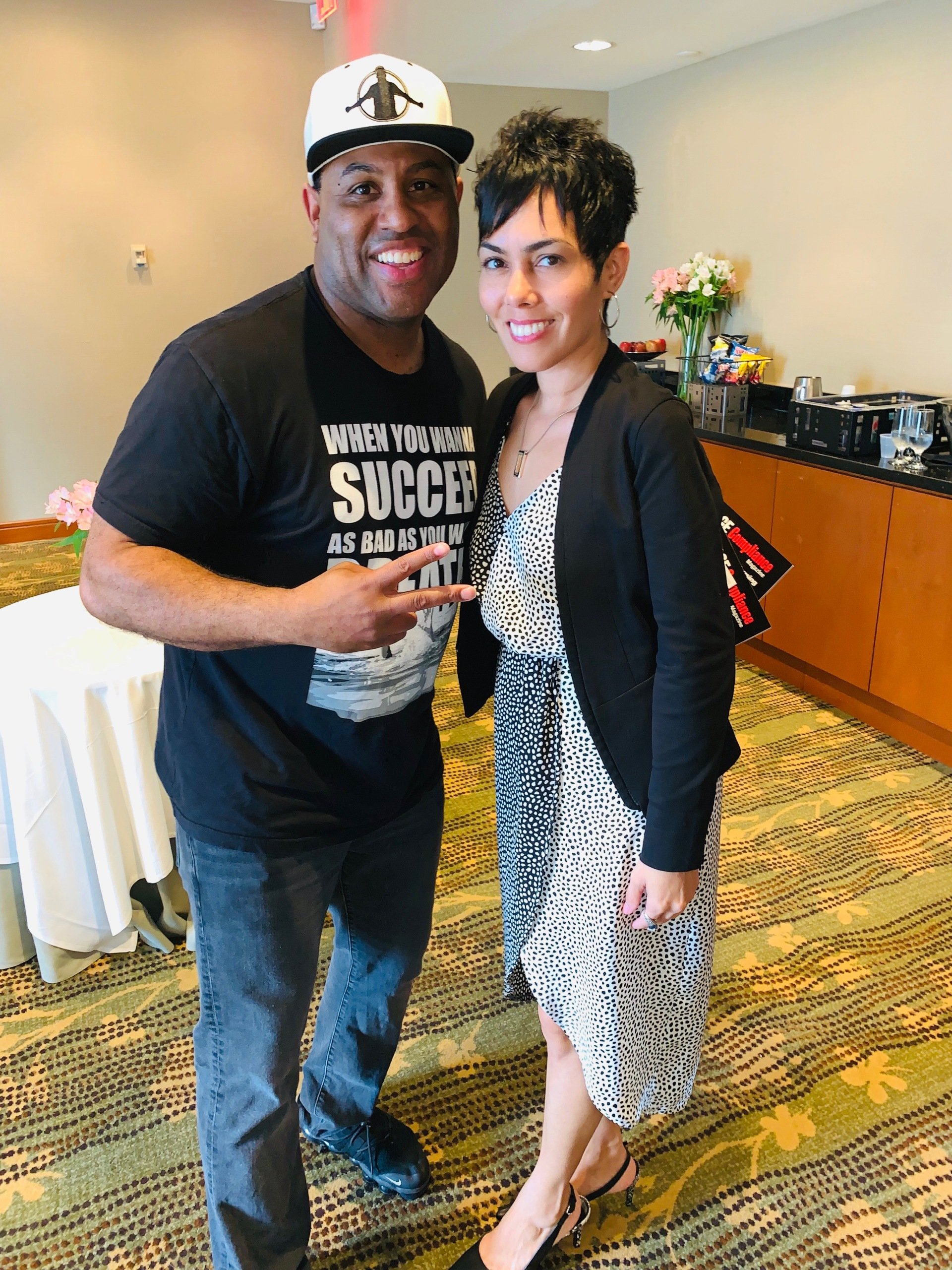 Dalila with a colleague at an industry conference booth