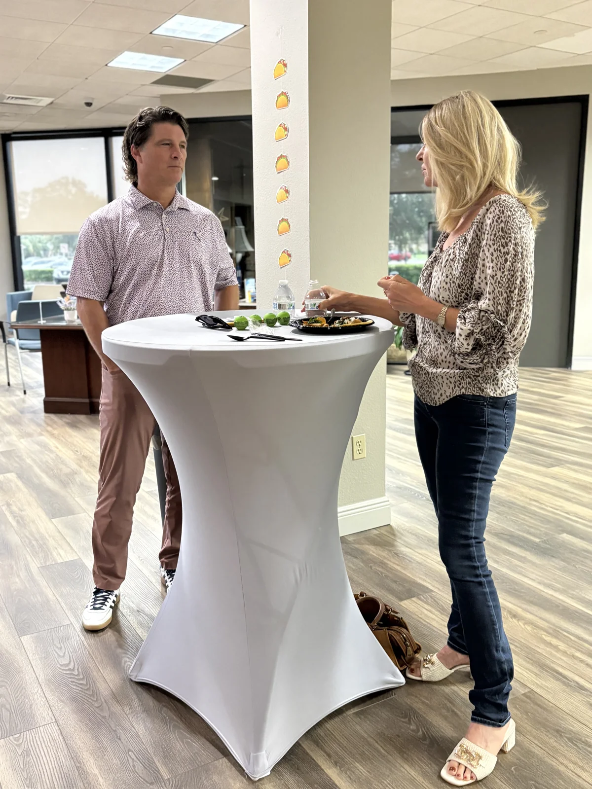 Guests connecting over food at a cocktail table