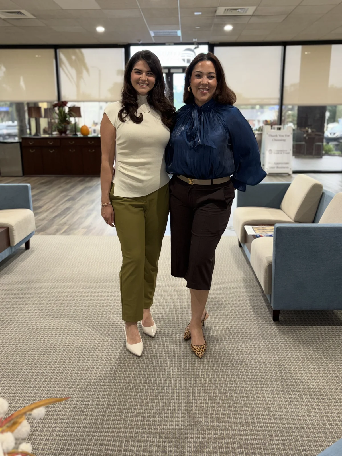 Two guests posing together in the event space