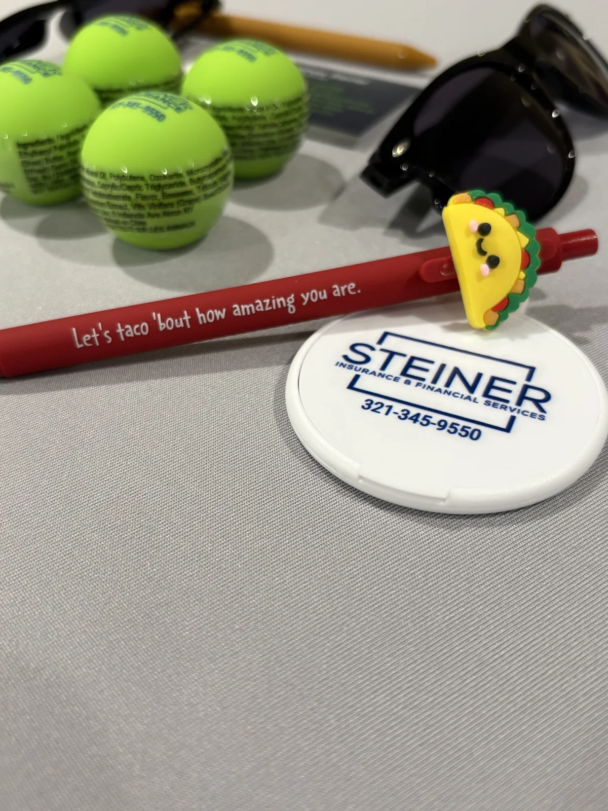 Event table with tennis balls and a paddle