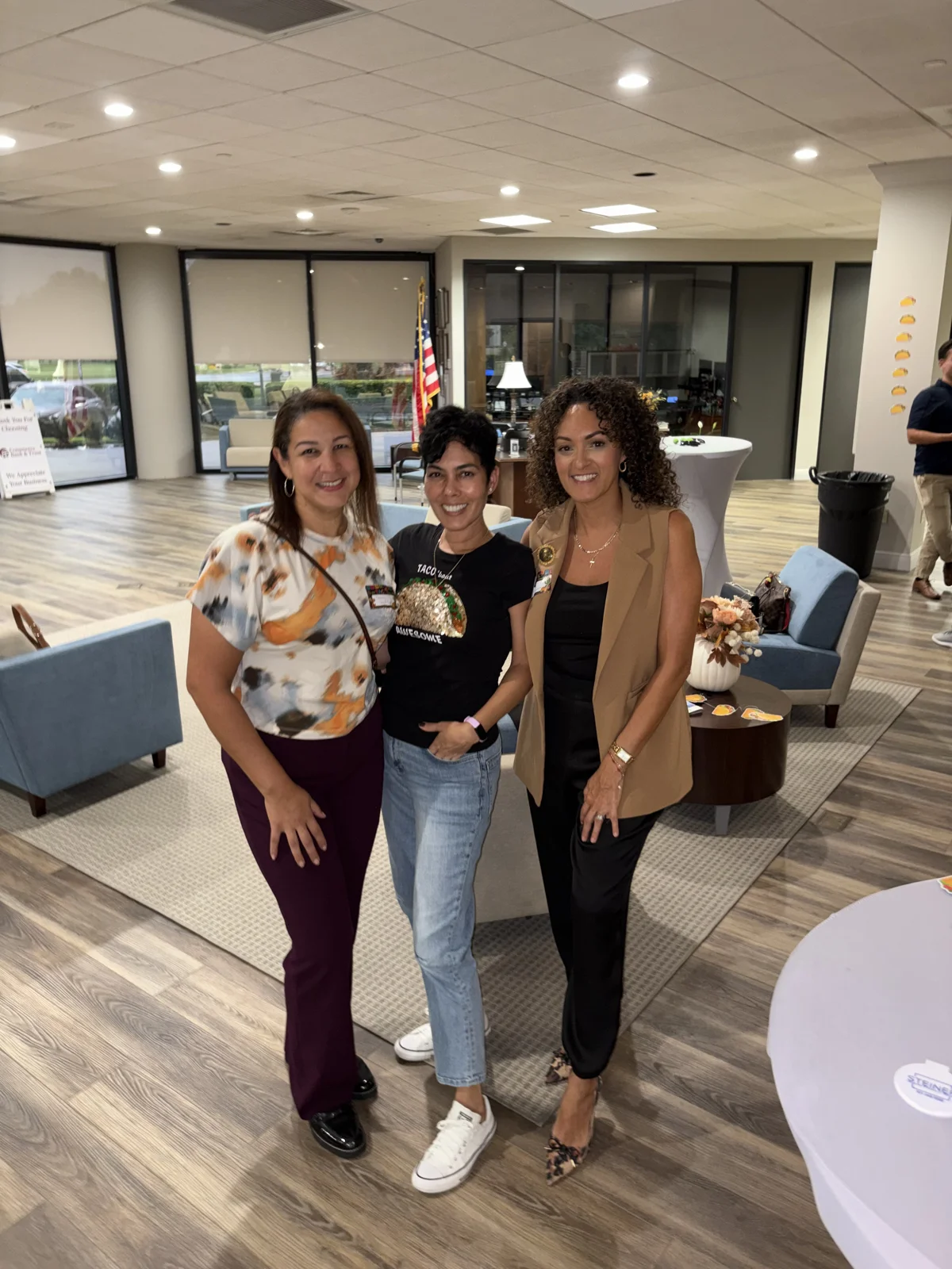 Three guests posing in the lounge