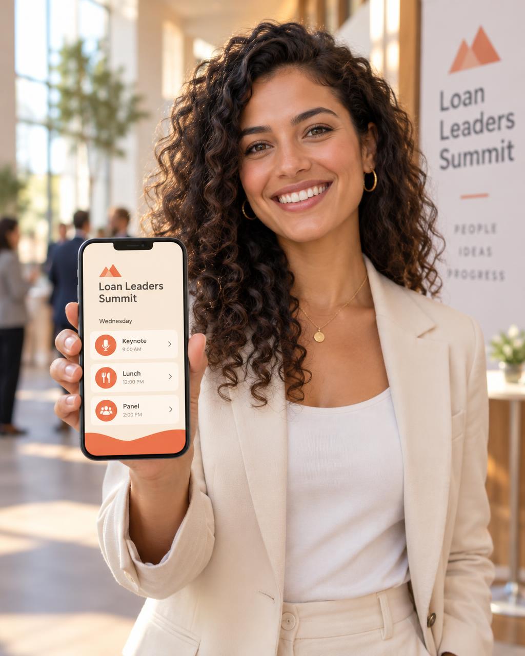 Smiling attendee at a conference checking the event schedule app on her phone